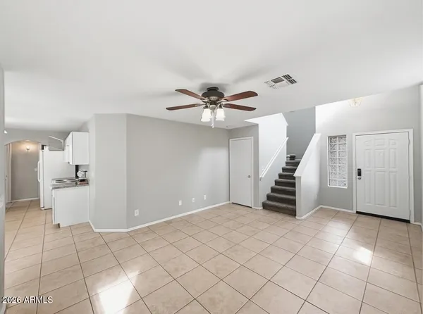 a view of an empty room with a window