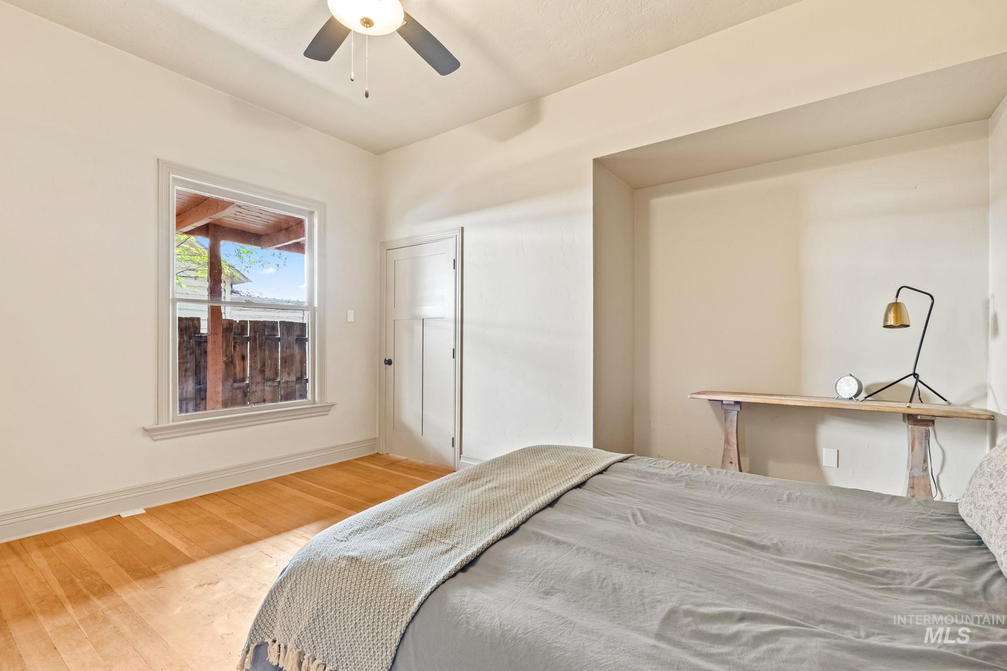 424 West Main Street Weiser, ID 83672 - Photo 14 of 30 Hardwood flooring, light-toned walls, and a ceiling fan create a comfortable atmosphere