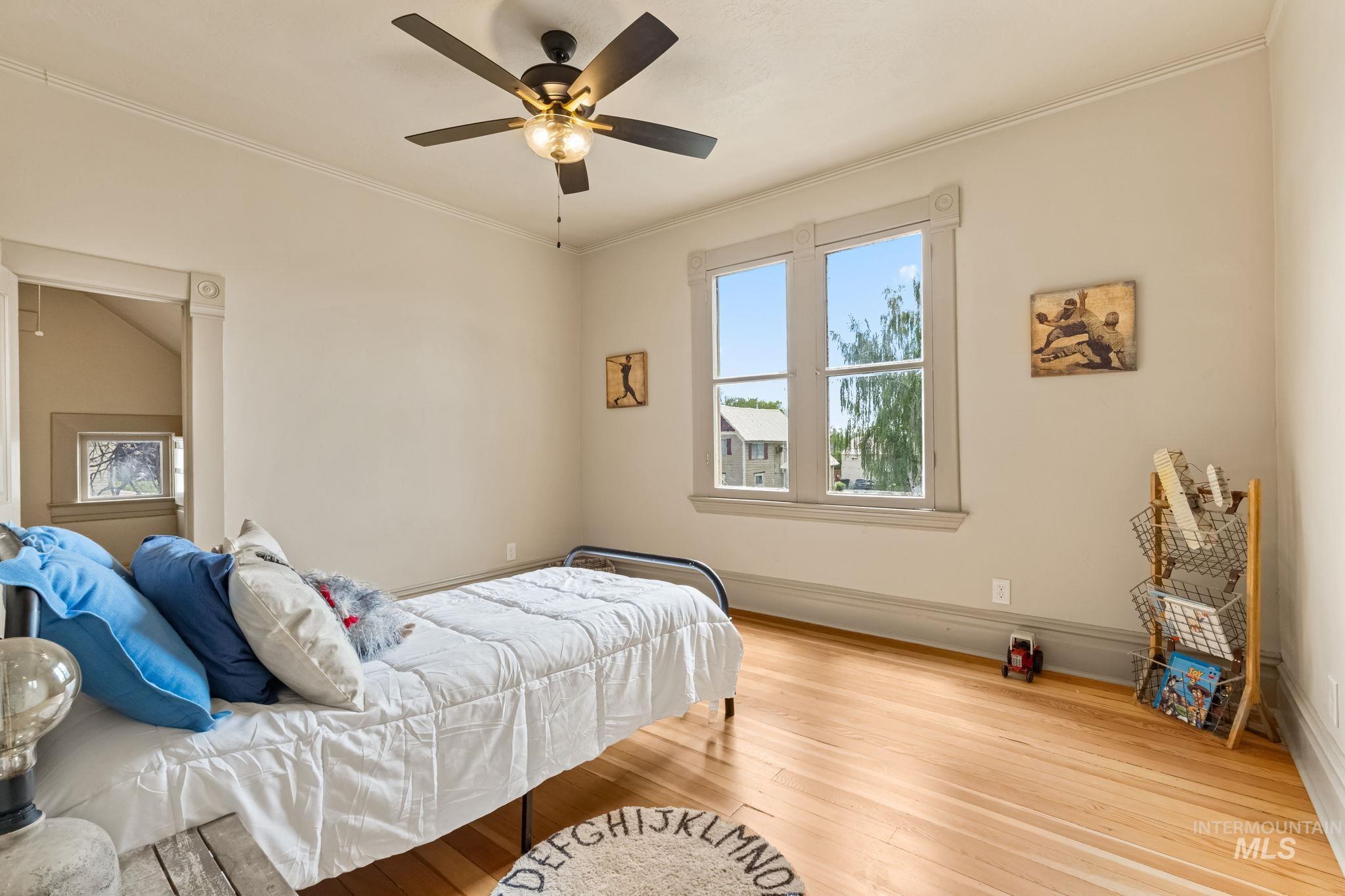 424 West Main Street Weiser, ID 83672 - Photo 19 of 30 Hardwood flooring complemented by a window with detailed trim