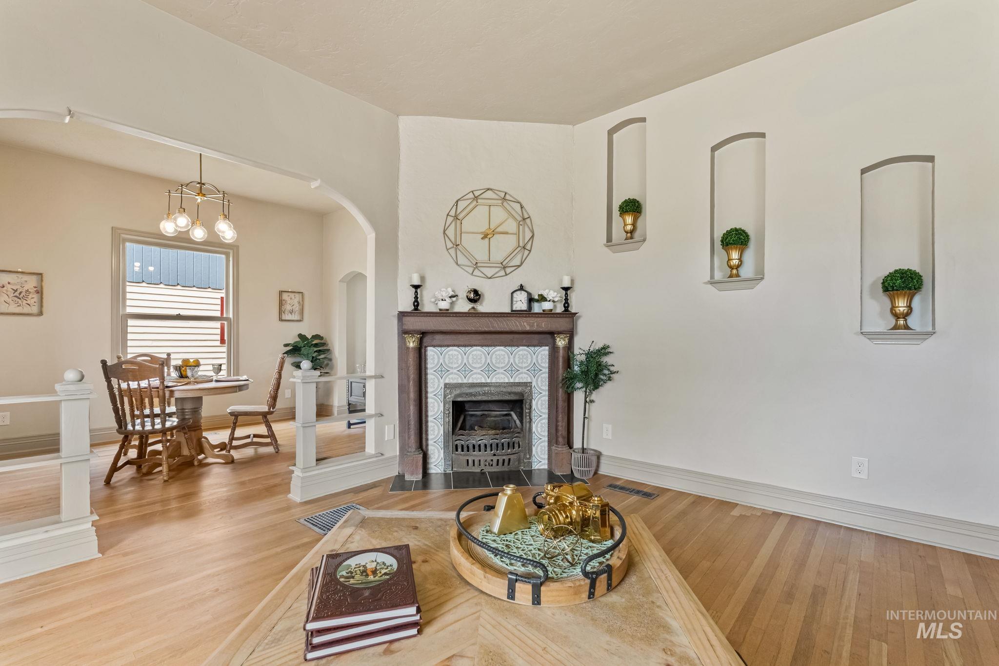 424 West Main Street Weiser, ID 83672 - Photo 4 of 30 Built-in fireplace with an ornate mantel and patterned tile surround