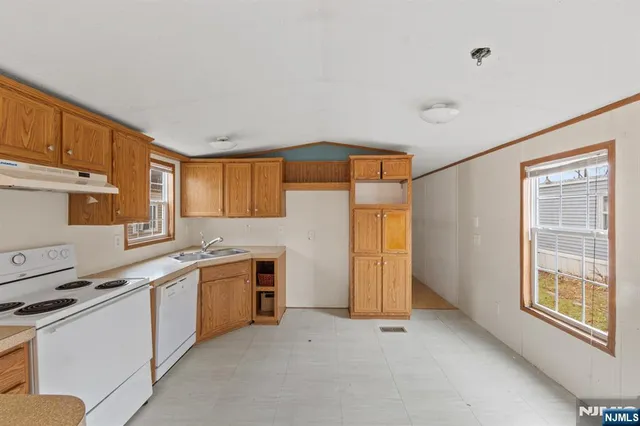 a view of a kitchen with a sink