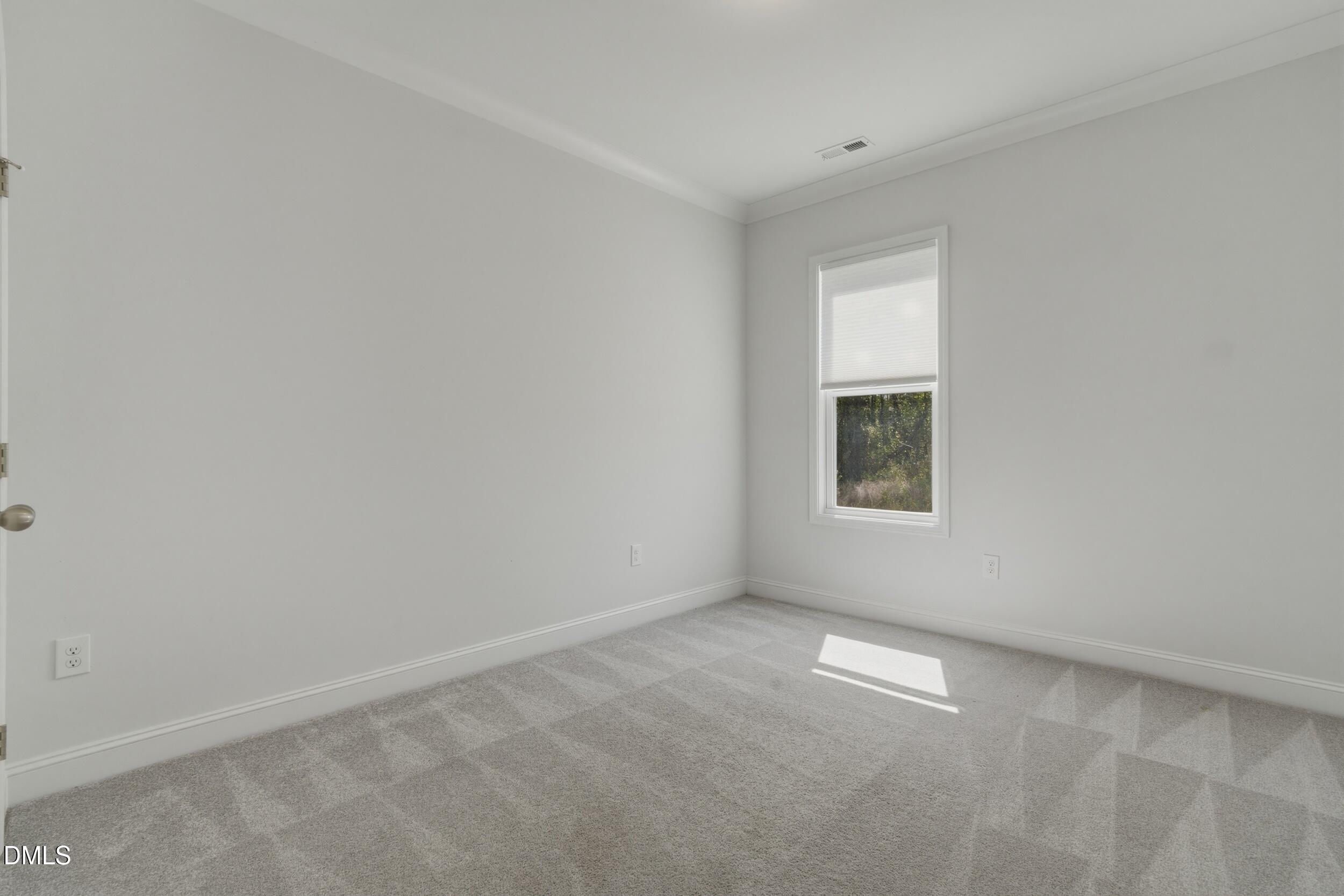 386 Howards Crossing Drive Wendell, NC 27591 - Photo 14 of 31 a view of an empty room with a window