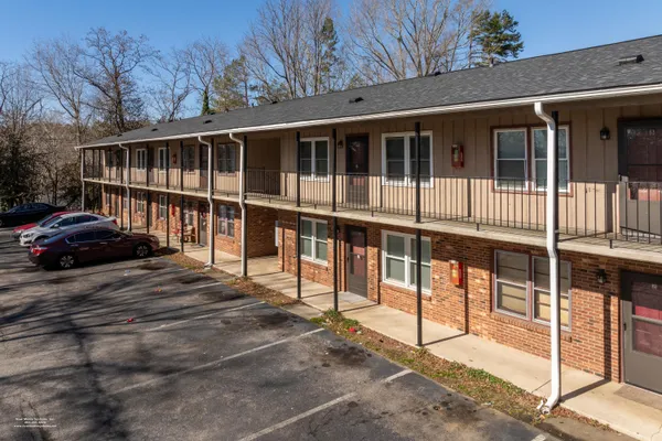 a view of a house with backyard and porch
