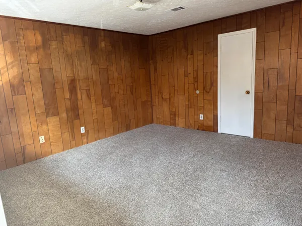 a view of an empty room and a window