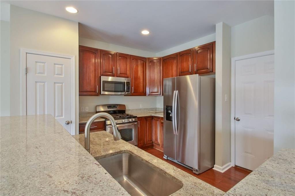 231 Maple Ridge Drive Canonsburg, PA 15317 - Photo 8 of 25 Upgraded selections include custom granite, cherry cabinetry and stainless appliances...including a GAS stove!