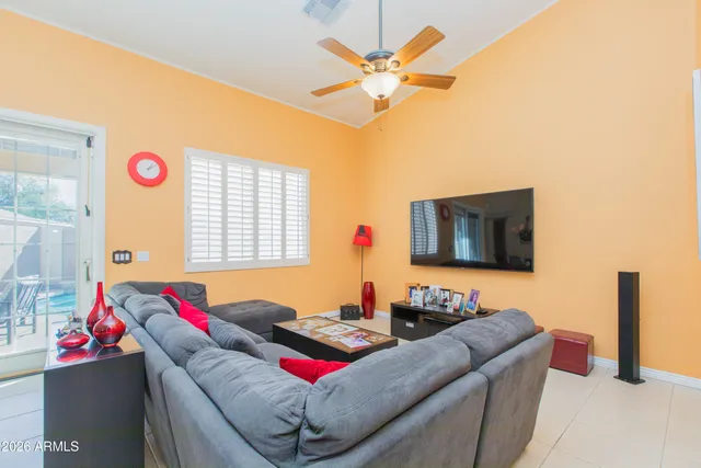 a large kitchen with granite countertop a island in the center a counter space dining table and stainless steel appliances