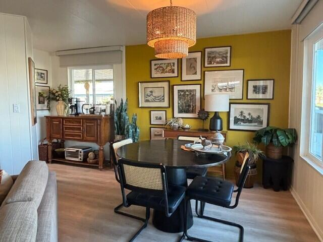 49305 Highway 74, Unit 109 Palm Desert, CA 92260 - Photo 17 of 52 a living room with furniture and wooden floor