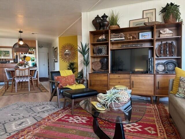 49305 Highway 74, Unit 109 Palm Desert, CA 92260 - Photo 19 of 52 a living room with furniture and a flat screen tv