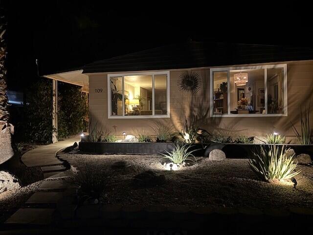 49305 Highway 74, Unit 109 Palm Desert, CA 92260 - Photo 2 of 52 a front view of a house with a yard