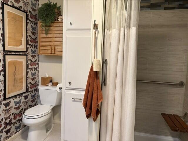 49305 Highway 74, Unit 109 Palm Desert, CA 92260 - Photo 25 of 52 a bathroom with a toilet a sink and a shower