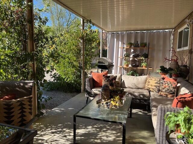 49305 Highway 74, Unit 109 Palm Desert, CA 92260 - Photo 29 of 52 a living room filled with furniture and a couch