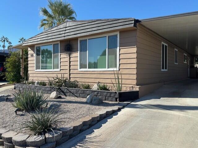 49305 Highway 74, Unit 109 Palm Desert, CA 92260 - Photo 3 of 52 a front view of a house