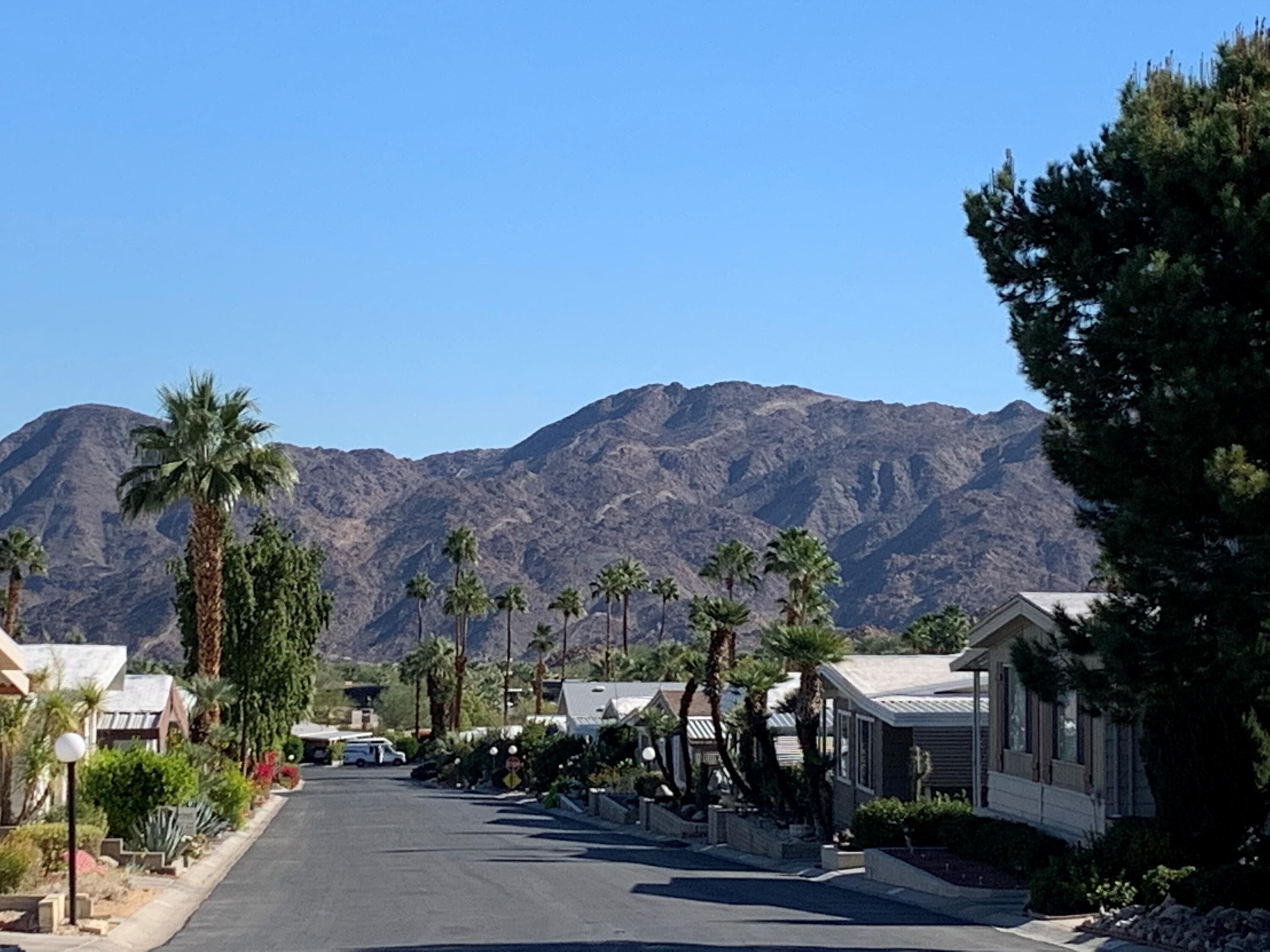 49305 Highway 74, Unit 109 Palm Desert, CA 92260 - Photo 41 of 52 a view of houses with a street