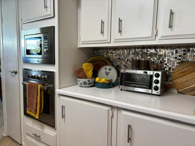 49305 Highway 74, Unit 109 Palm Desert, CA 92260 - Photo 7 of 52 a kitchen with table and cabinets