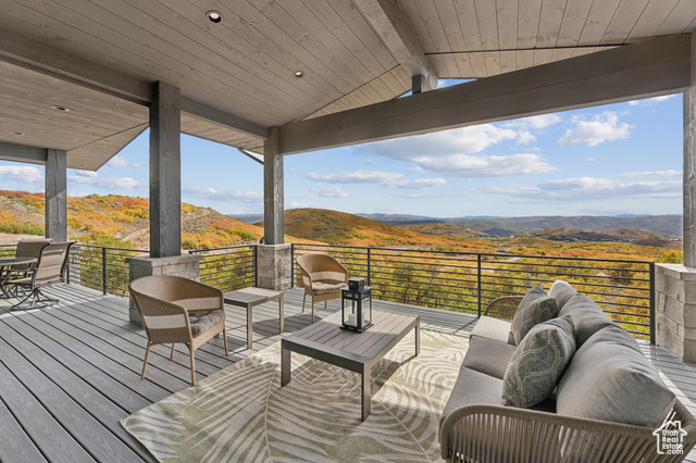 2280 East Outlaw Road, Unit 56 Kamas, UT 84036 - Photo 53 of 59 Wooden deck with outdoor lounge area, a mountain view, a patio, and outdoor dining area
