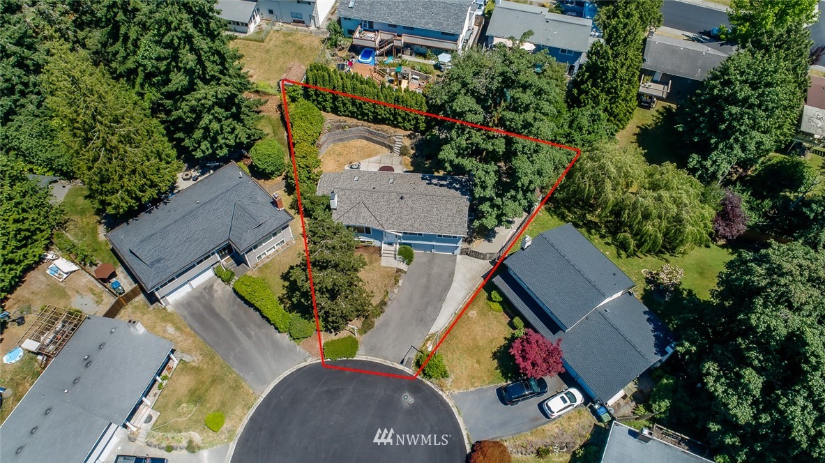 12740 Southeast 190th Place Renton, WA 98058 - Photo 2 of 28 an aerial view of a house with a yard and trees