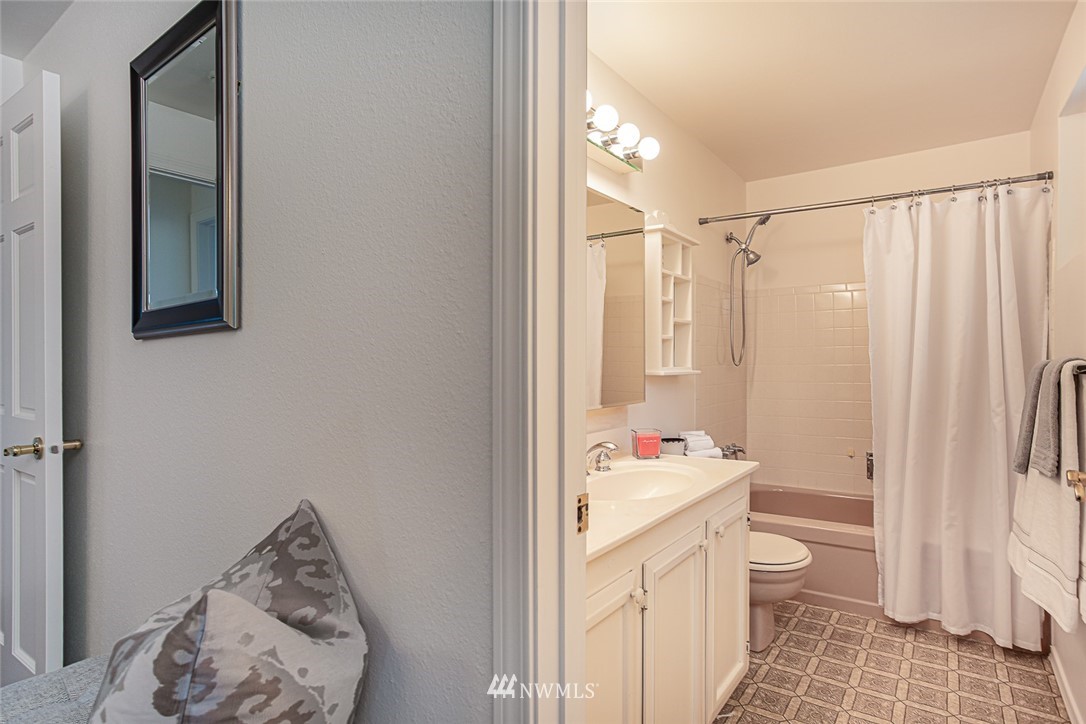 12740 Southeast 190th Place Renton, WA 98058 - Photo 12 of 28 a bathroom with a sink toilet and shower