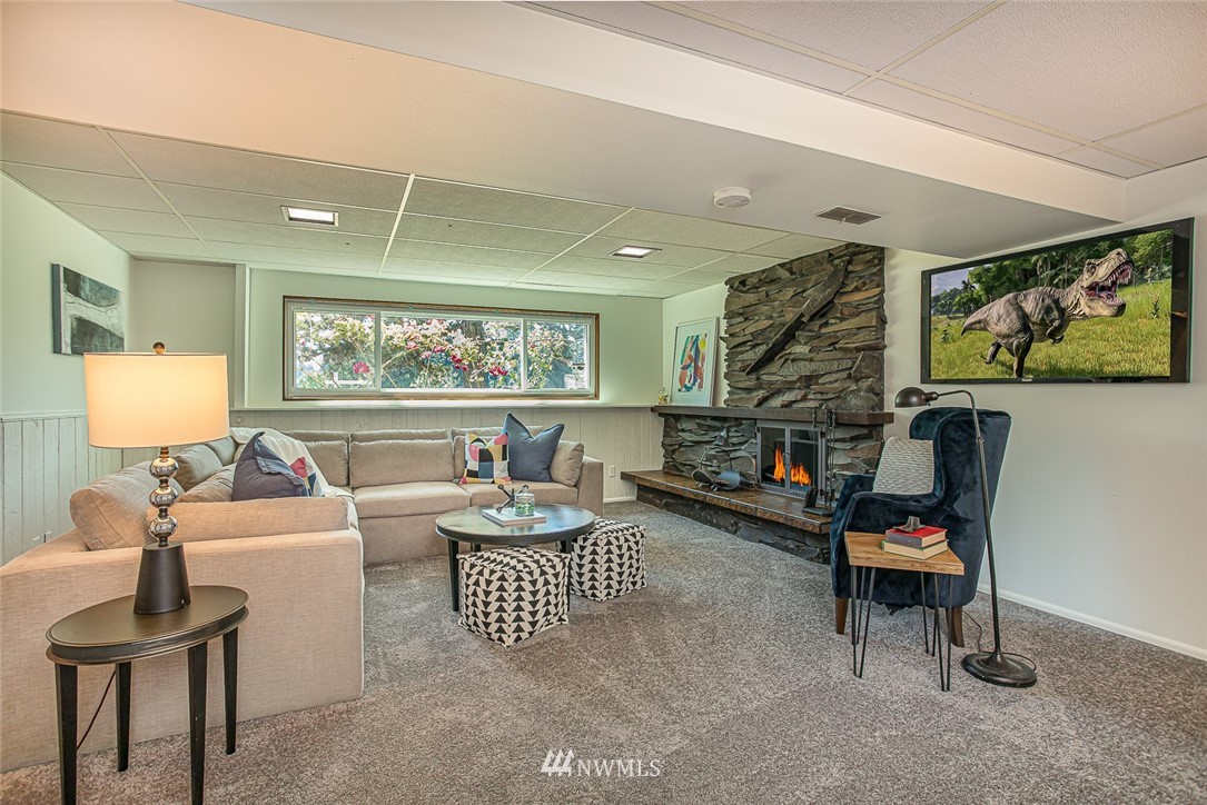 12740 Southeast 190th Place Renton, WA 98058 - Photo 17 of 28 a living room with furniture and a flat screen tv