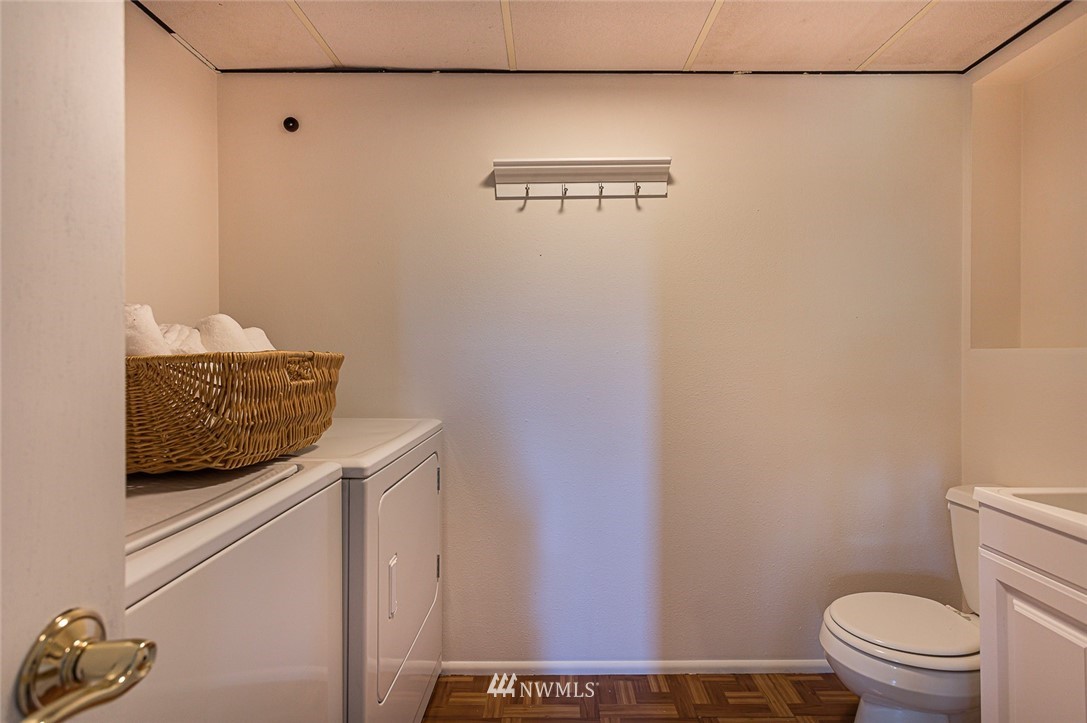 12740 Southeast 190th Place Renton, WA 98058 - Photo 19 of 28 a bathroom with a granite countertop sink and a toilet