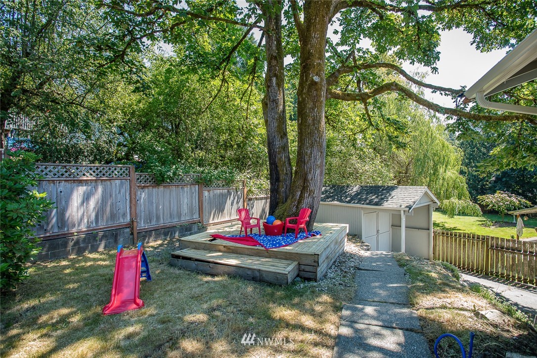 12740 Southeast 190th Place Renton, WA 98058 - Photo 23 of 28 a backyard of a house with table and chairs