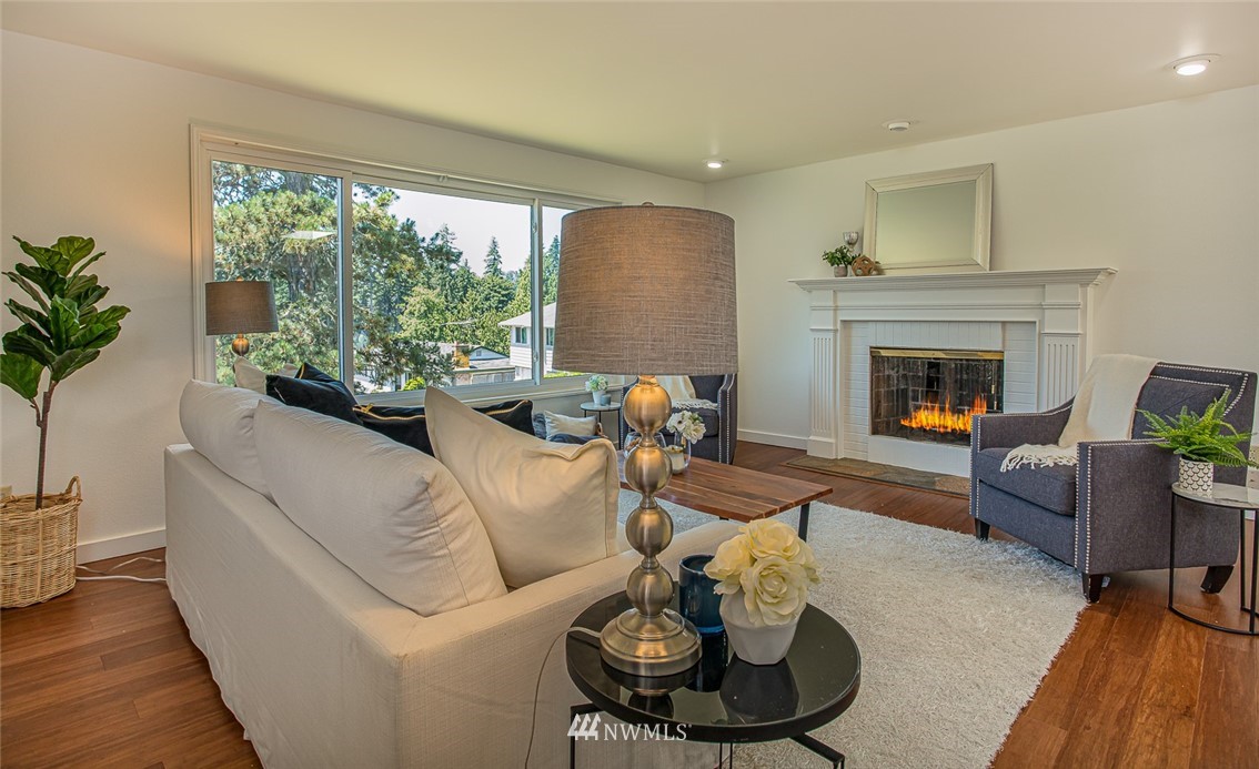 12740 Southeast 190th Place Renton, WA 98058 - Photo 4 of 28 a living room with furniture and a fireplace