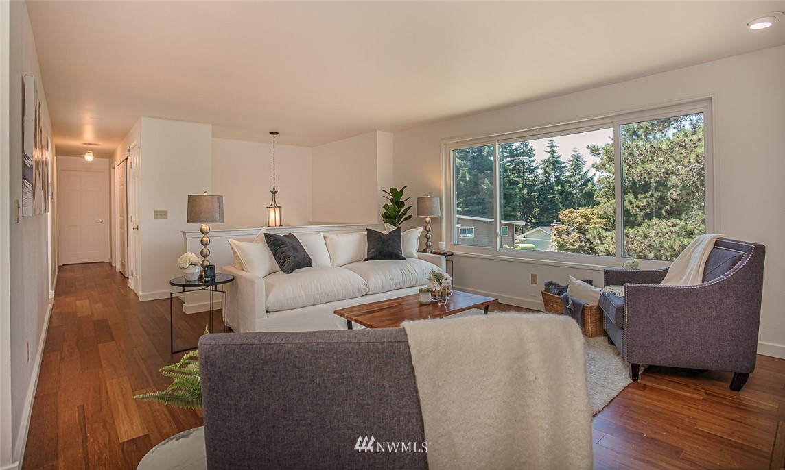 12740 Southeast 190th Place Renton, WA 98058 - Photo 5 of 28 a living room with furniture and a large window