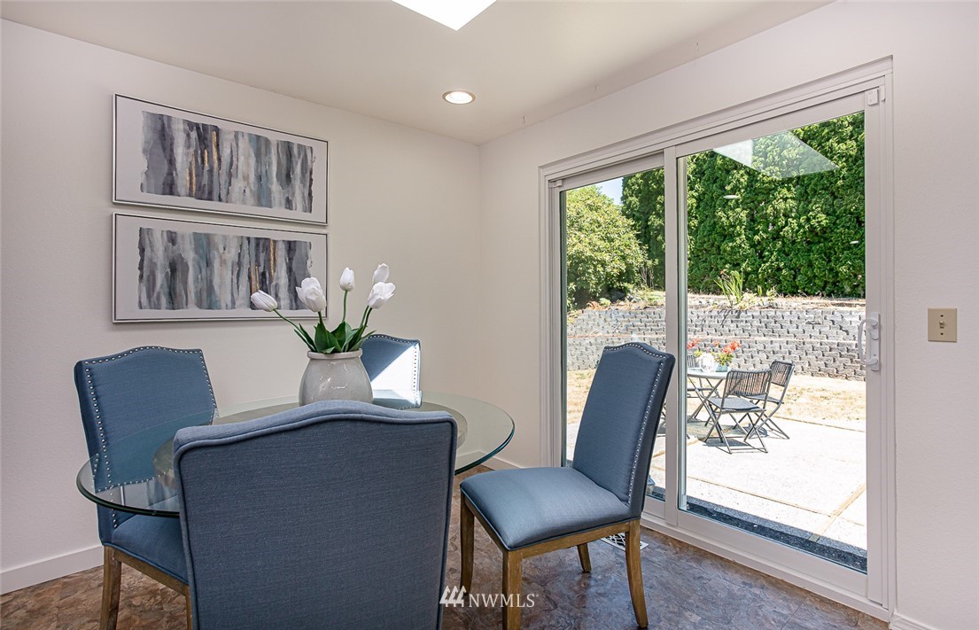 12740 Southeast 190th Place Renton, WA 98058 - Photo 9 of 28 a dining room with furniture window and wooden floor