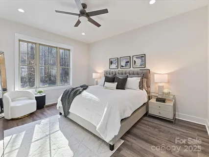 a bedroom with a bed and a couch