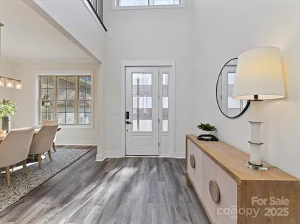 a room with wooden floor and windows