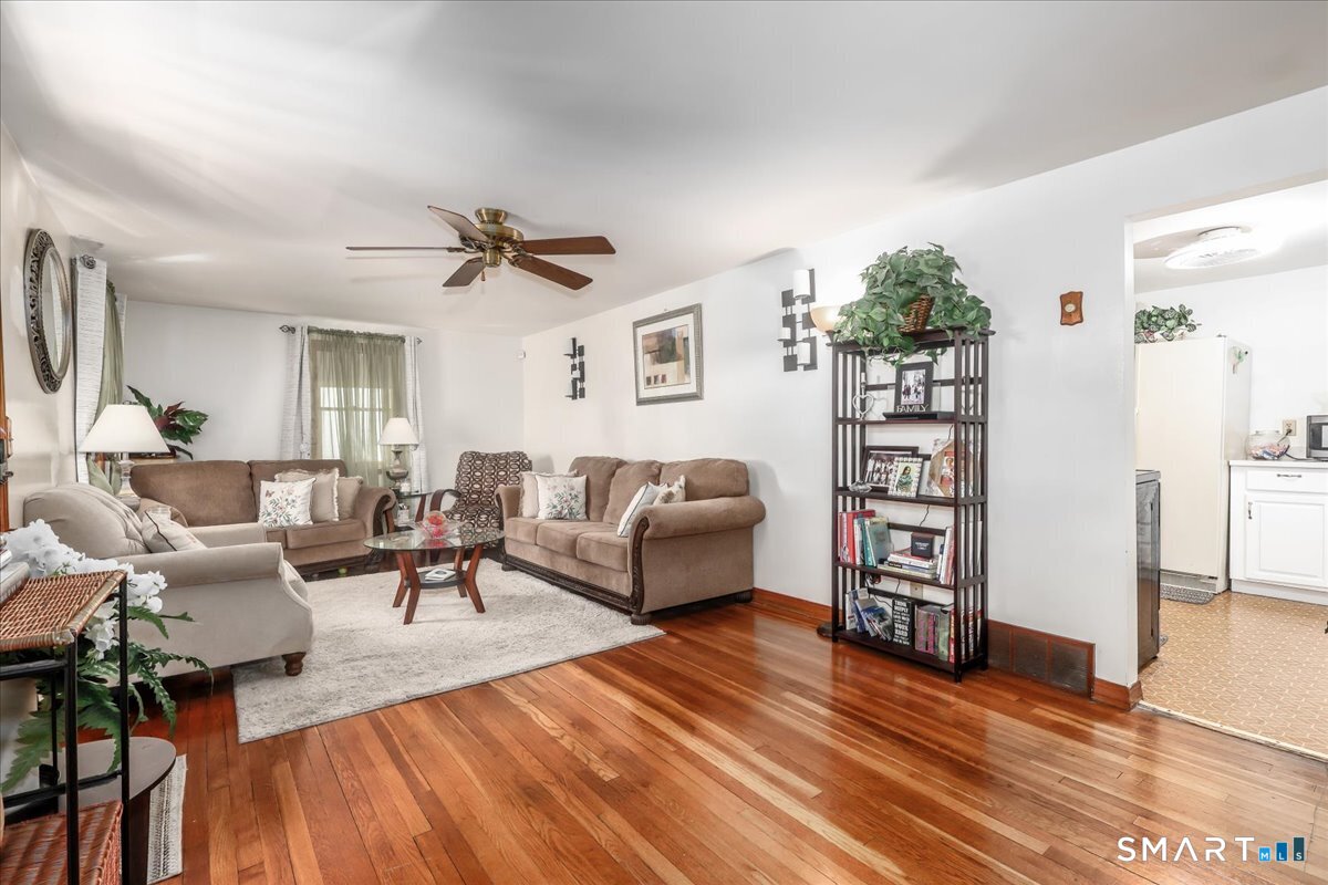 306 Welton Street Hamden, CT 06517 - Photo 5 of 38 a living room with furniture and wooden floor