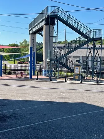 a view of small pool in front of house