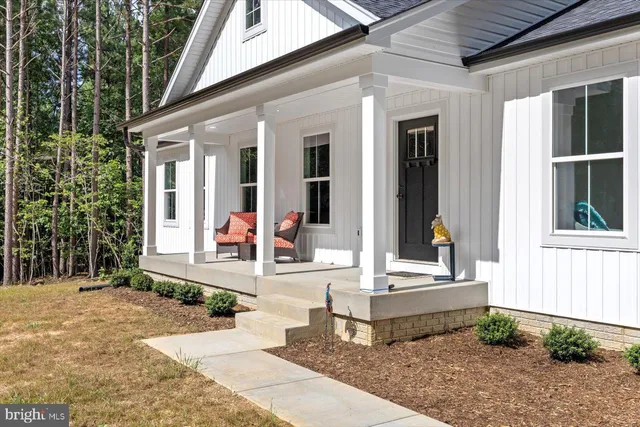 a front view of a house with a porch