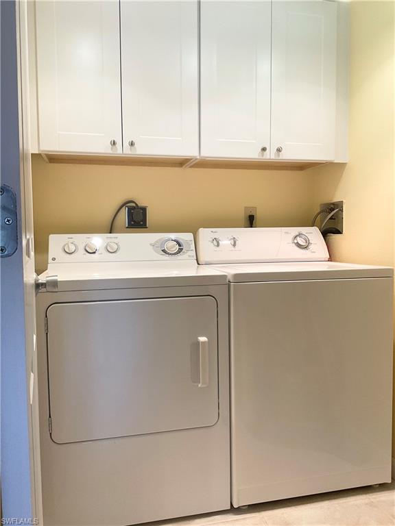 1165 Clam Court, Unit 7 Naples, FL 34102 - Photo 12 of 34 a view of washer and dryer with washer and dryer