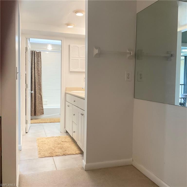 1165 Clam Court, Unit 7 Naples, FL 34102 - Photo 21 of 34 a view of a bathroom with mirror