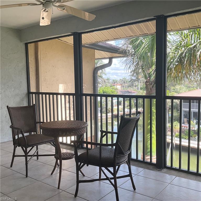 1165 Clam Court, Unit 7 Naples, FL 34102 - Photo 23 of 34 a view of a dining room with furniture window and outside view