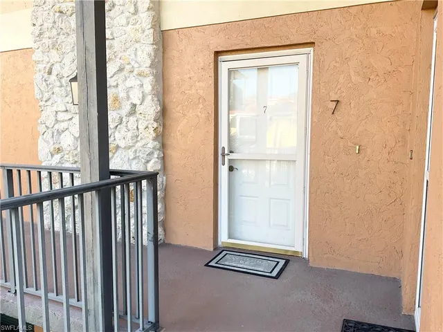 a view of a livingroom with wooden floor
