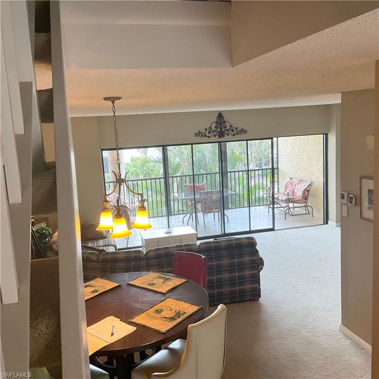 1165 Clam Court, Unit 7 Naples, FL 34102 - Photo 4 of 34 a room with pool table and windows