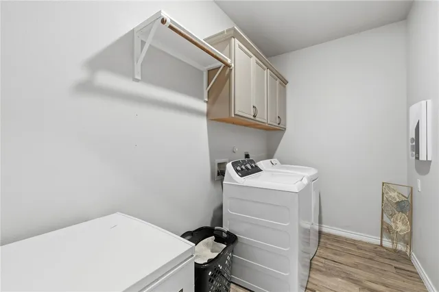 a bathroom with a granite countertop double vanity sink and a mirror