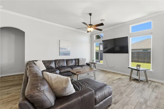 a bedroom with a bed gym equipment and a desk