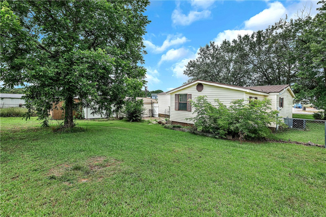 1004 Wiles Road Anderson, SC 29625 - Photo 24 of 26 A quaint residential structure featuring a lush yard and mature trees.