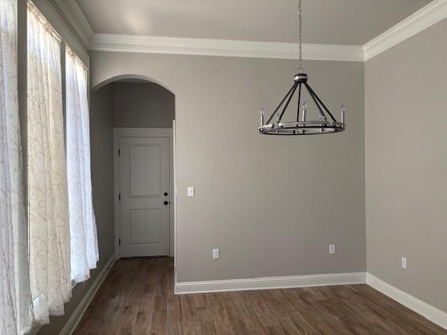 6896 Bethany Reed Circle Blanchard, LA 71107 - Photo 4 of 9 Spacious interior room featuring wood-finish flooring, a contemporary chandelier, crown molding, and a paneled door