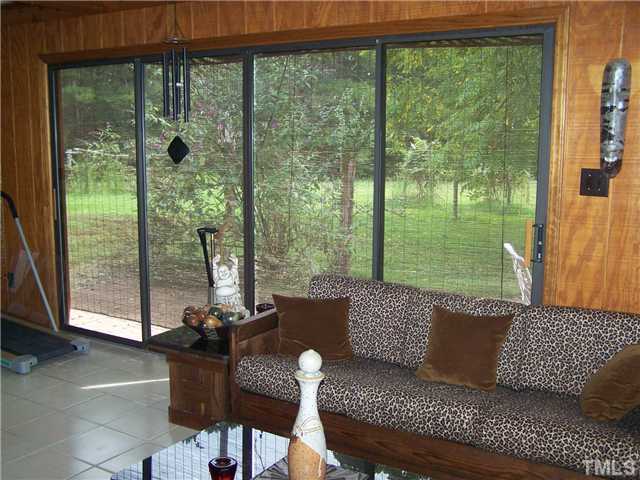 4506 Hight Road Oxford, NC 27565 - Photo 8 of 24 The Sun Room is bright with plenty of glass. The floors are ceramic tile. One of two patios is outside the sliding glass door. This room is not counted in the square footage as it does not have HVAC, but could be added.