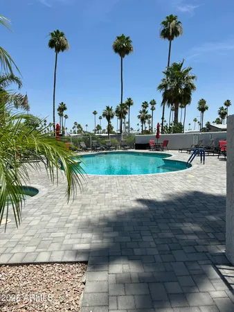 a view of a house with a yard and sitting area