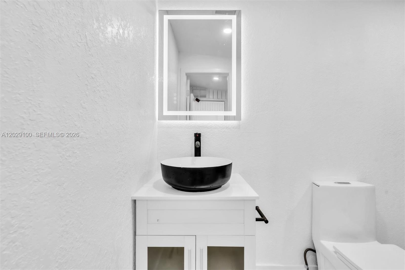 11790 Southwest 34th Street Miami, FL 33175 - Photo 41 of 56 a bathroom with a toilet and a sink