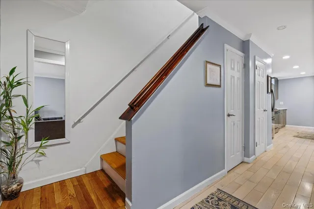a bathroom with a granite countertop sink and a toilet