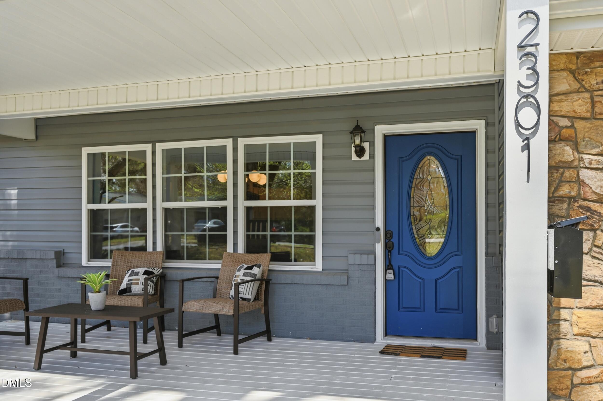 2301 Milburnie Road Raleigh, NC 27610 - Photo 23 of 23 a front view of a house with outdoor seating