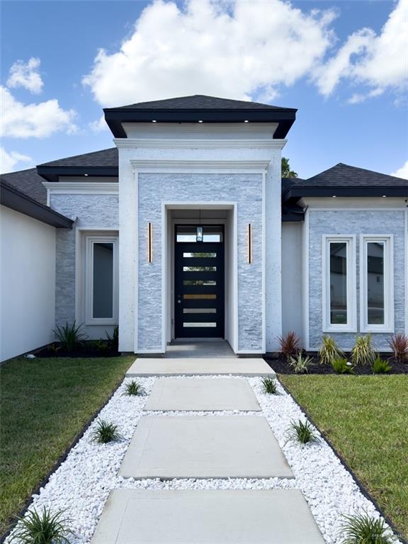 4812 Duke Avenue McAllen, TX 78504 - Photo 3 of 42 a front view of a house with a yard