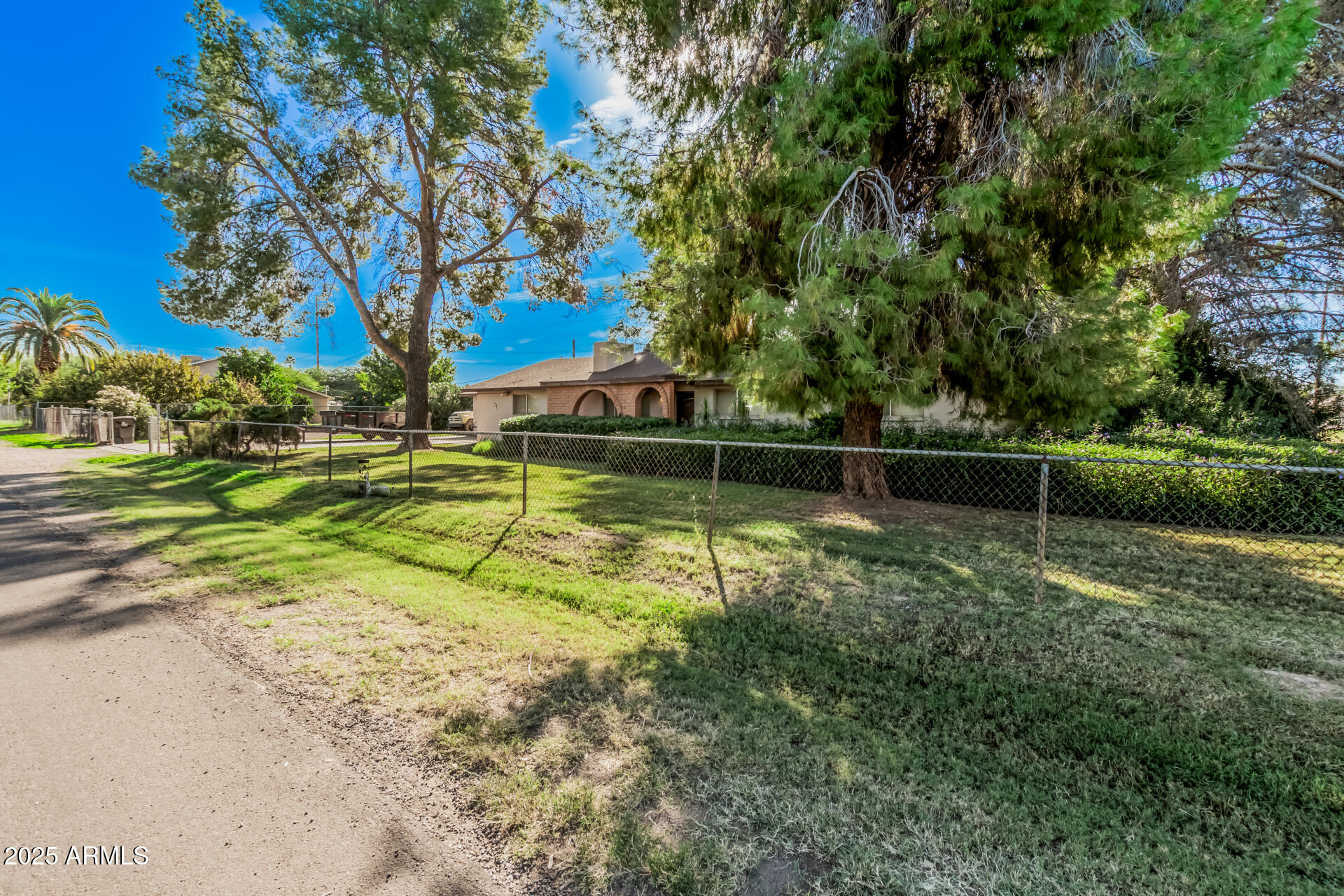 3531 East Campbell Road Gilbert, AZ 85234 - Photo 2 of 8 a view of yard with swimming pool and green space
