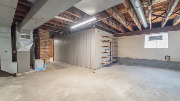 a view of empty room with stairs