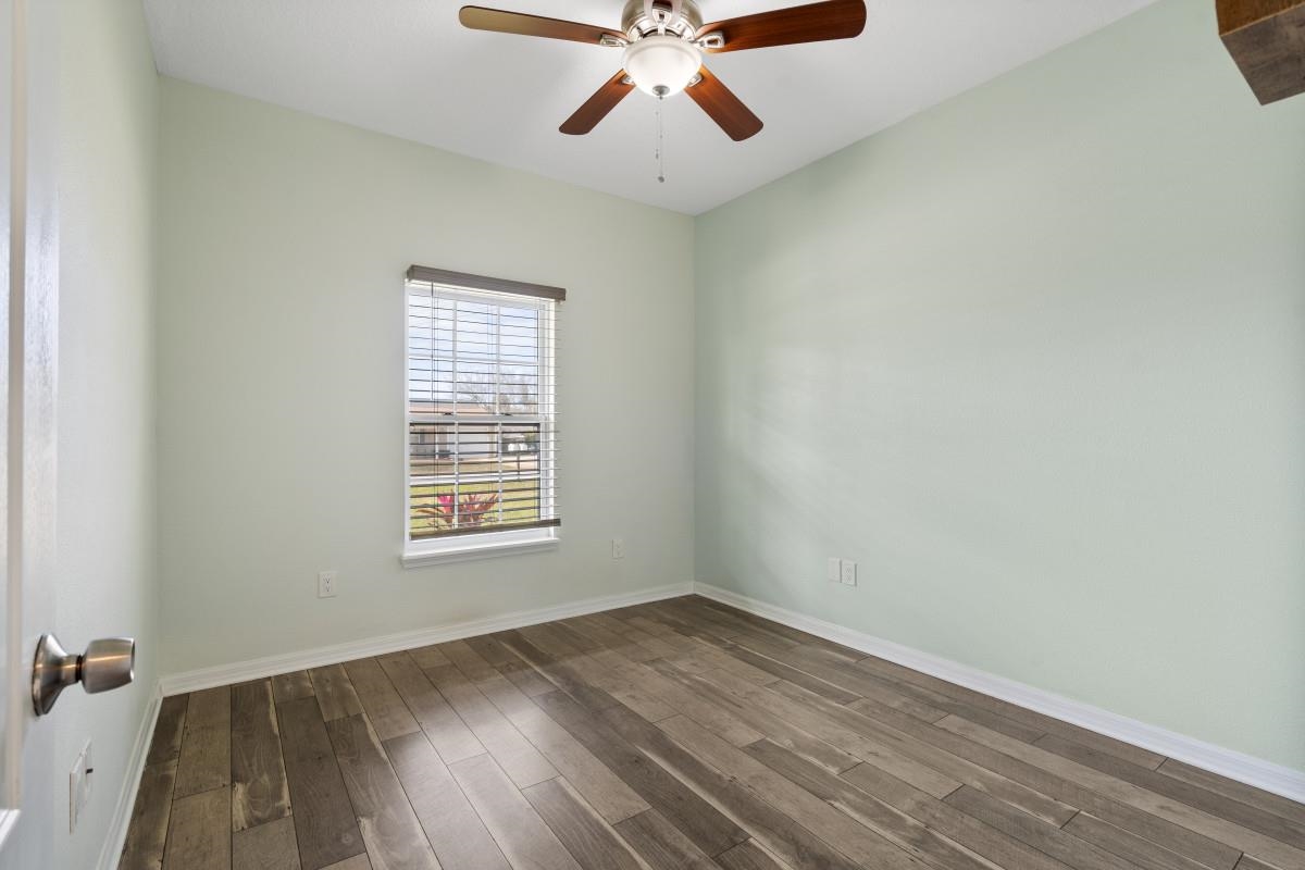 315 Segovia Road St. Augustine, FL 32086 - Photo 30 of 31 wooden floor in an empty room with a window